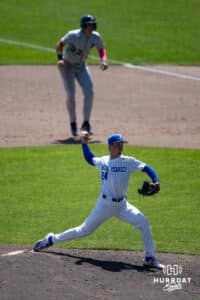 Creighton Bluejay pitcher Ian Koosman (24) throws a pitch while Xavier Musketeer infielder Connor Misch (32) is leading off during a college baseball game on Sunday, May 11, 2025 in Omaha, Nebraska. Photo by John S. Peterson.