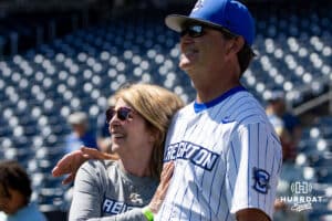 Creighton Bluejays head coach Ed Servais watches a video with his wife recognizing his years of service after the game against Xavier Musketeers during a college baseball game on Sunday, May 11, 2025 in Omaha, Nebraska. Photo by John S. Peterson.