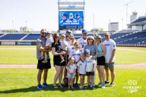Creighton Bluejays head coach Ed Servais psoses for a photo with his famiy after the game against the Xavier Musketeers during a college baseball game on Sunday, May 11, 2025 in Omaha, Nebraska. Photo by John S. Peterson.