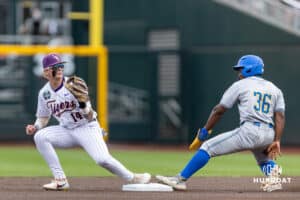 UCLA Bruin outfielder Dean West (36) out at second base against LSU Tiger infielder Daniel Dickinson (14) in the first inning during the College World Series on Monday, June 16, 2025 in Omaha, Nebraska. Photo by John S. Peterson.