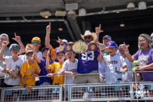 LSU Tigers fans cheer before a baseball game Sunday June 22nd 2025 in Omaha Nebraska. Photo by Brandon Tiedemann.