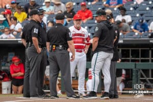 Louisvilles Dan McDonnell and Coastal’s Kevin Schall meet before a baseball game Thursday June 18th 2025 in Omaha Nebraska. Photo by Brandon Tiedemann.
