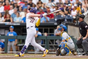 LSU Tiger first baseman Jared Jones (22) hits a three run home run in the first inning against the UCLA Bruins during the College World Series on Monday, June 16, 2025 in Omaha, Nebraska. Photo by John S. Peterson.