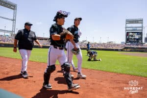 Coastal Carolina Chanticleer pitcher Jacob Morrison (51) and the catcher Caden Bodine (17) head to the dugout to start the in the second game of the finals against the LSU Tigers during the College World Series on Sunday, June 22, 2025 in Omaha, Nebraska. Photo by John S. Peterson.