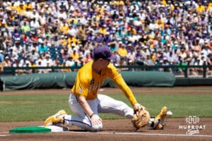 LSU Tiger first baseman Jared Jones (22) stops a ball during a baseball game Sunday June 22nd 2025 in Omaha Nebraska. Photo by Brandon Tiedemann.