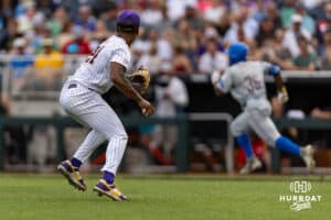 LSU Tiger pitcher Anthony Eyanson (24) picks up the ball from a bunt by UCLA Bruin outfielder Dean West (36) in the second inning during the College World Series on Monday, June 16, 2025 in Omaha, Nebraska. Photo by John S. Peterson.
