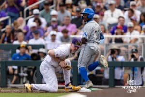 LSU Tiger first baseman Jared Jones (22) forces out UCLA Bruin outfielder Dean West (36) from a SAC bunt in the second inning during the College World Series on Monday, June 16, 2025 in Omaha, Nebraska. Photo by John S. Peterson.