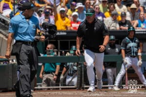 Coastal Carolina Chanteliers Head Coach Kevin Schnall talks with an umpire during a baseball game Sunday June 22nd 2025 in Omaha Nebraska. Photo by Brandon Tiedemann.