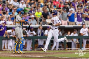LSU Tiger outfielder Ethan Frey (16) scores a run in the third inning against the UCLA Bruins during the College World Series on Monday, June 16, 2025 in Omaha, Nebraska. Photo by John S. Peterson.