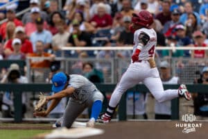 UCLA Bruin first baseman Mulivai Levu (39) forces out Arkansas Razorback outfielder Justin Thomas Jr. (4) out at first in the second inning during the College World Series on Tuesday, June 17, 2025 in Omaha, Nebraska. Photo by John S. Peterson.