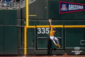 LSU Tiger outfielder Derek Curiel (6) jumps for a ball during a baseball game Sunday June 22nd 2025 in Omaha Nebraska. Photo by Brandon Tiedemann.