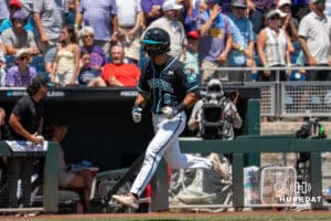 Coastal Carolina Chantelier infielder Dean Mihos (8) celebrates a home run during a baseball game Sunday June 22nd 2025 in Omaha Nebraska. Photo by Brandon Tiedemann.