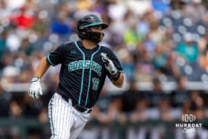 Coastal Carolina Chanticleer Colby Thorndyke (16) doubles with a three run RBI against the Louisville Cardinals in the first inning during the College World Series on Wednesday, June 18, 2025 in Omaha, Nebraska. Photo by John S. Peterson.