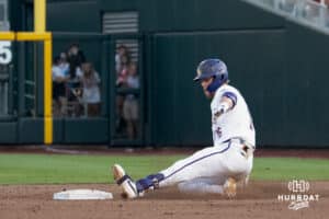 LSU Tiger outfielder Ethan Frey (16) slides during a baseball game Thursday June 18th 2025 in Omaha Nebraska. Photo by Brandon Tiedemann.