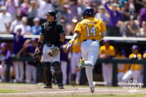 LSU Tiger infielder Daniel Dickinson (14) scores a run in the third inning against the Coastal Carolina Chanticleers in the second game of the finals during the College World Series on Sunday, June 22, 2025 in Omaha, Nebraska. Photo by John S. Peterson.