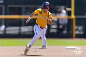 LSU Tiger utility Jake Brown (7) advanced to third from first from a single against the Coastal Carolina Chanticleers in the fourth inning in the second game of the finals during the College World Series on Sunday, June 22, 2025 in Omaha, Nebraska. Photo by John S. Peterson.