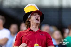 Arkansas Razorbacks fan celebrates the two runs in the eighth inning against the LSU Tigers during the College World Series on Wednesday, June 18, 2025 in Omaha, Nebraska. Photo by John S. Peterson.