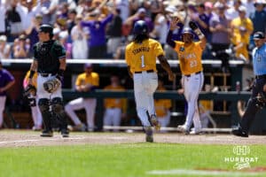 LSU Tiger outfielder Chris Stanfield (1) scores after Luis Hernandez (23) in the fourth inning against the Coastal Carolina Chanticleers in the second game of the finals during the College World Series on Sunday, June 22, 2025 in Omaha, Nebraska. Photo by John S. Peterson.