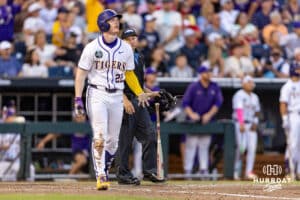 LSU Tiger first baseman Jared Jones (22) watches the ball go over the wall for a home run in the eighth inning against the Arkansas Razorbacks during the College World Series on Wednesday, June 18, 2025 in Omaha, Nebraska. Photo by John S. Peterson.