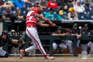 Louisville Cardinal utility Tague Davis (13) hits a one run double against the Coastal Carolina Chanticleers in the sixth inning during the College World Series on Wednesday, June 18, 2025 in Omaha, Nebraska. Photo by John S. Peterson.