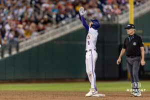LSU Tiger outfielder Derek Curiel (6) singles and advanced to second on an throwing error in the ninth inning against the Arkansas Razorbacks during the College World Series on Wednesday, June 18, 2025 in Omaha, Nebraska. Photo by John S. Peterson.
