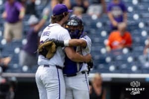 LSU Tiger pitcher Chase Shores (34) and the catcher Luis Hernanandez hug celebrating the win over the UCLA Bruins during the College World Series on