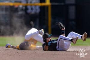 LSU Tiger Daniel Dickinson (14) caught stealing second by Coastal Carolina Chanticleer infielder Blake Barthol (7) in the eighth inning in the second game of the finals during the College World Series on Sunday, June 22, 2025 in Omaha, Nebraska. Photo by John S. Peterson.