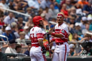 Louisville Cardinal Tague Davis (13) fist bumps Lucas Moore during the College World Series on Wednesday, June 18, 2025 in Omaha, Nebraska. Photo by John S. Peterson.