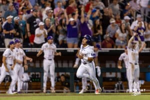 LSU Tiger infielder Steven Milam (4) running home to score in the ninth inning against the Arkansas Razorbacks during the College World Series on Wednesday, June 18, 2025 in Omaha, Nebraska. Photo by John S. Peterson.