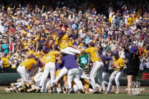 LSU Tigers dog pile after a baseball game Sunday June 22nd 2025 in Omaha Nebraska. Photo by Brandon Tiedemann.
