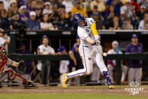 LSU Tiger first baseman Jared Jones (22) singles scoring Hermandez to win the game and to the finals over the Arkansas Razorbacks during the College World Series on Wednesday, June 18, 2025 in Omaha, Nebraska. Photo by John S. Peterson.