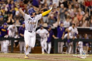 LSU Tiger first baseman Jared Jones (22) celebrates the win over the against the Arkansas Razorbacks after single driving in Hernandez against the Arkansas Razorbacks during the College World Series on Wednesday, June 18, 2025 in Omaha, Nebraska. Photo by John S. Peterson.