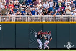 Coastal Carolina Chanticleer outfielder Wells Sykes (20) catches a ball at the warning track during a baseball game Thursday June 18th 2025 in Omaha Nebraska. Photo by Brandon Tiedemann.