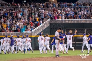 Arkansas Razorback infielder Wehiwa Aloy (9) watches as LSU celebrates a win after a baseball game Thursday June 18th 2025 in Omaha Nebraska. Photo by Brandon Tiedemann.