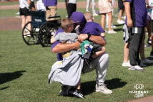 LSU Tigers Marc Wanka hugs family after a baseball game Sunday June 22nd 2025 in Omaha Nebraska. Photo by Brandon Tiedemann.