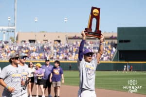 LSU Tiger outfielder Derek Curiel (6) holds the trophy during a baseball game Sunday June 22nd 2025 in Omaha Nebraska. Photo by Brandon Tiedemann.