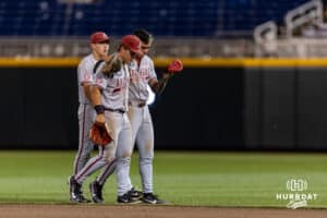 Arkansas Razorback Wehiwa Aloy (9) comforts Cam Kozeal after the loss to the LSU Tigers during the College World Series on Wednesday, June 18, 2025 in Omaha, Nebraska. Photo by John S. Peterson.