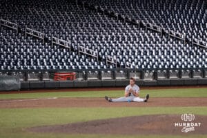 Arkansas Razorback infielder Brent Iredale (10) sits on the field after a baseball game Thursday June 18th 2025 in Omaha Nebraska. Photo by Brandon Tiedemann.