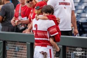 Louisville Cardinal outfielder Garret Pike (2) hugs a family member after a baseball game Thursday June 18th 2025 in Omaha Nebraska. Photo by Brandon Tiedemann.