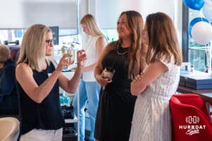 Ladies talking during the National Women’s Athletic Leadership Alliance Awards Monday July 21st 2025 in Omaha, Nebraska. Photo by Brandon Tiedemann.