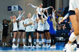 The Creighton Volleyball team raises Alivia Hausmann for a celebration during the Creighton Volleyball Exhibition game vs Colorado State on August 16th, 2025 in Omaha, Nebraska. Photo by Drew Balus