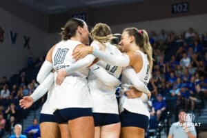 The Creighton Volleyball team hugs after the first set match won during the Creighton Volleyball Exhibition game vs Colorado State on August 16th, 2025 in Omaha, Nebraska. Photo by Drew Balus