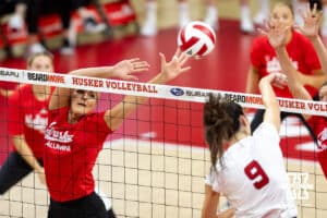 Nebraska Cornhusker Andi Jackson (15) jumps to block a spike from Nebraska Cornhusker Virginia Adriano (9) in the first set during the Nebraska alumni match on Saturday, Aug. 16, 2025 in Lincoln, Nebraska. Photo by John S. Peterson.