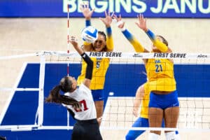 Nebraska Cornhusker Harper Murray (27) spikes the ball against Pittsburgh Panthers Olivia Babcock (5) and Bre Kelley (21) in the first set during the AVAC Showcase volleyball match on Friday, Aug. 22, 2025, in Lincoln, Nebraska. Photo by John S. Peterson.