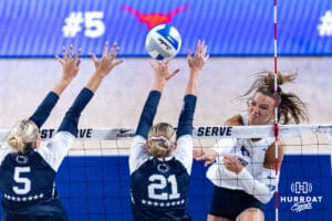 Creighton Bluejay Ava Marti (8) spikes the ball against Penn State Nittany Lions Jordan Hopp (5) and Izzy Starck (21) in the first set during the AVAC First Serve volleyball match on Saturday, Aug. 23, 2025 in Lincoln, Nebraska. Photo by John S. Peterson.