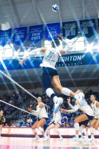Destiny Ndam-Simpson jumps to spike the ball during the Creighton Volleyball Exhibition game vs Colorado State on August 16th, 2025 in Omaha, Nebraska. Photo by Drew Balus