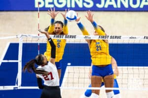 Nebraska Cornhusker Harper Murray (27) scores a point against Pittsburgh Panthers Olivia Babcock (5) and Bre Kelley (21) in the first set during the AVAC Showcase volleyball match on Friday, Aug. 22, 2025, in Lincoln, Nebraska. Photo by John S. Peterson.