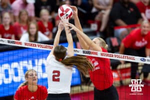 Nebraska Cornhusker Bergen Reilly (2) and Nebraska alumnus Lauren Stivrins (26) battle at the net in the first set during the Nebraska alumni match on Saturday, Aug. 16, 2025 in Lincoln, Nebraska. Photo by John S. Peterson.