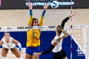 Nebraska Cornhusker Andi Jackson (15) spikes the ball against Pittsburgh Panther Blaire Bayless (8) in the first set during the AVAC Showcase volleyball match on Friday, Aug. 22, 2025, in Lincoln, Nebraska. Photo by John S. Peterson.