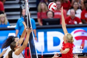 Nebraska alumnus Lauren Stivrins (26)reaches to hit the ball against Nebraska Cornhusker Rebekah Allick (5) and Virginia Adriano (9) during the Nebraska alumni match on Saturday, Aug. 16, 2025 in Lincoln, Nebraska. Photo by John S. Peterson.